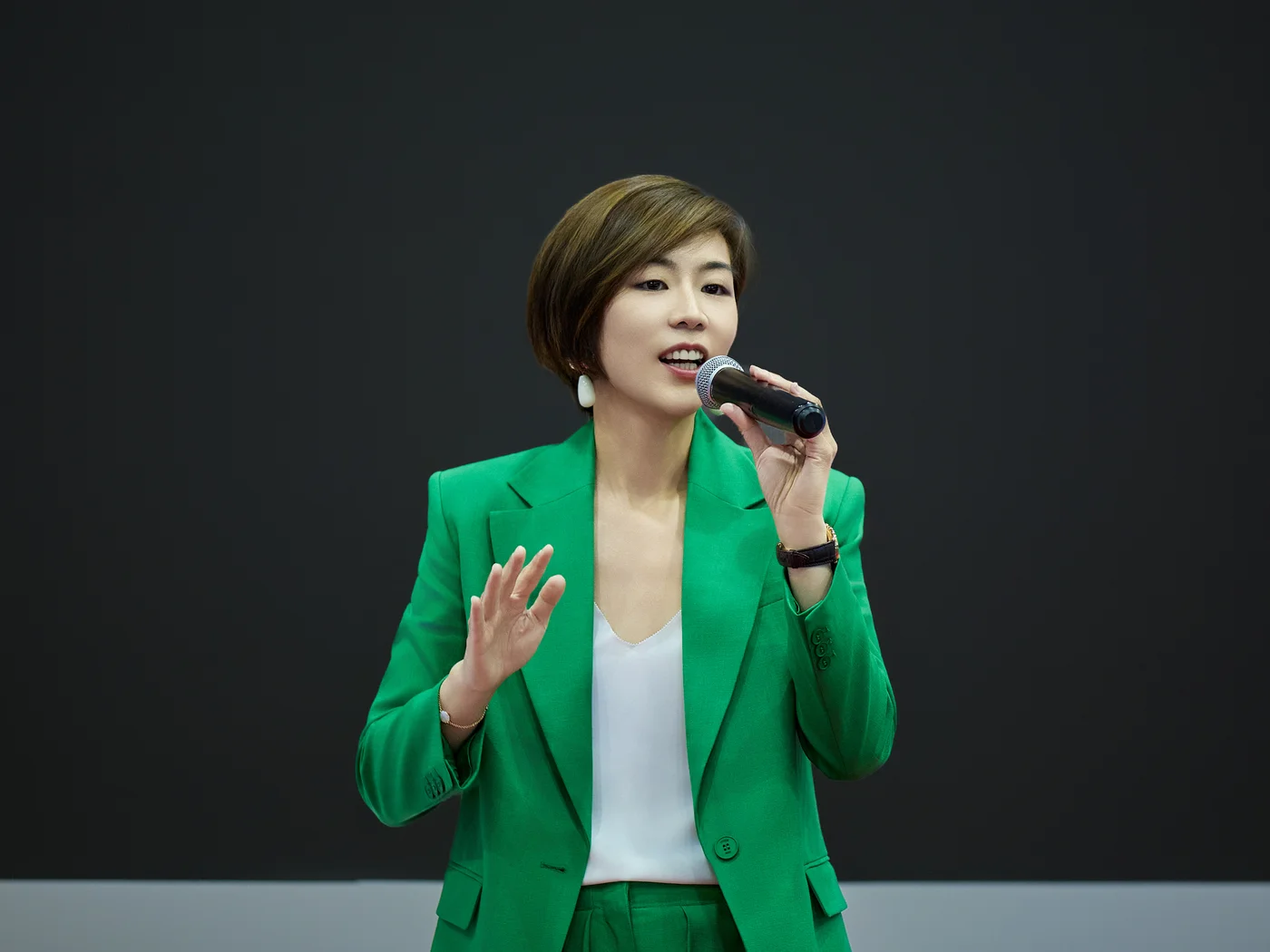 Claire Wang speaking on stage